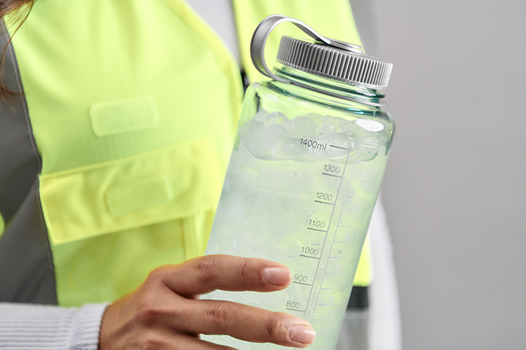 industrial worker holding water jug
